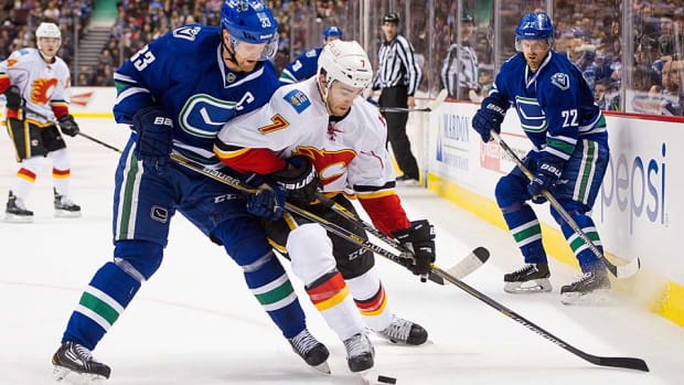 Sedins-Flames-Rich-Lam-Getty.jpg